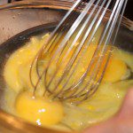 Incorporating the eggs into the hot sauce