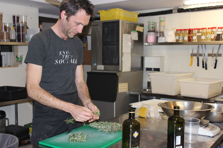 Holger preparing rosemary for the focacia.
