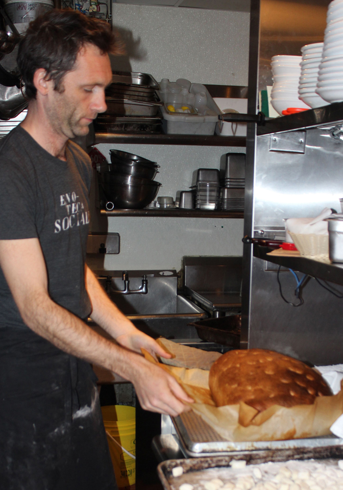 Holger setting the focaccia out to cool.