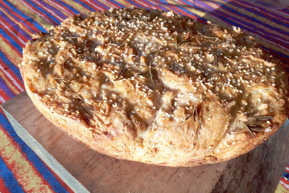 Overnight Sourdough with rosemary, rock salt, and sesame crust.