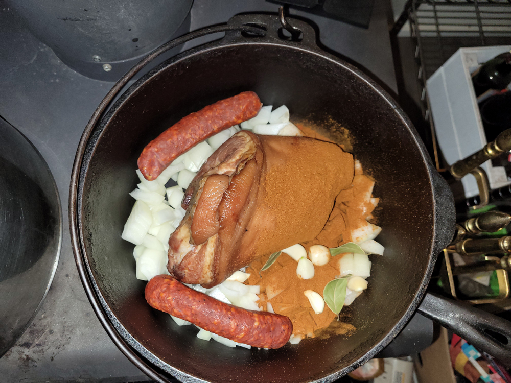 Assembled ingredients for Sopa de Garbanzo on the stove