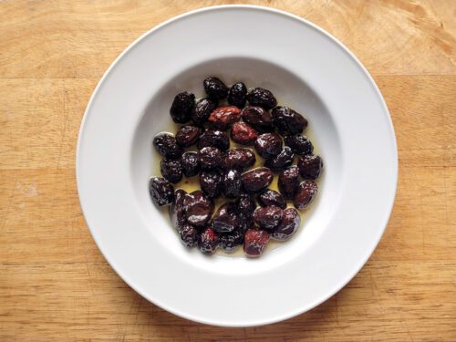 Dry cured olives on a dish