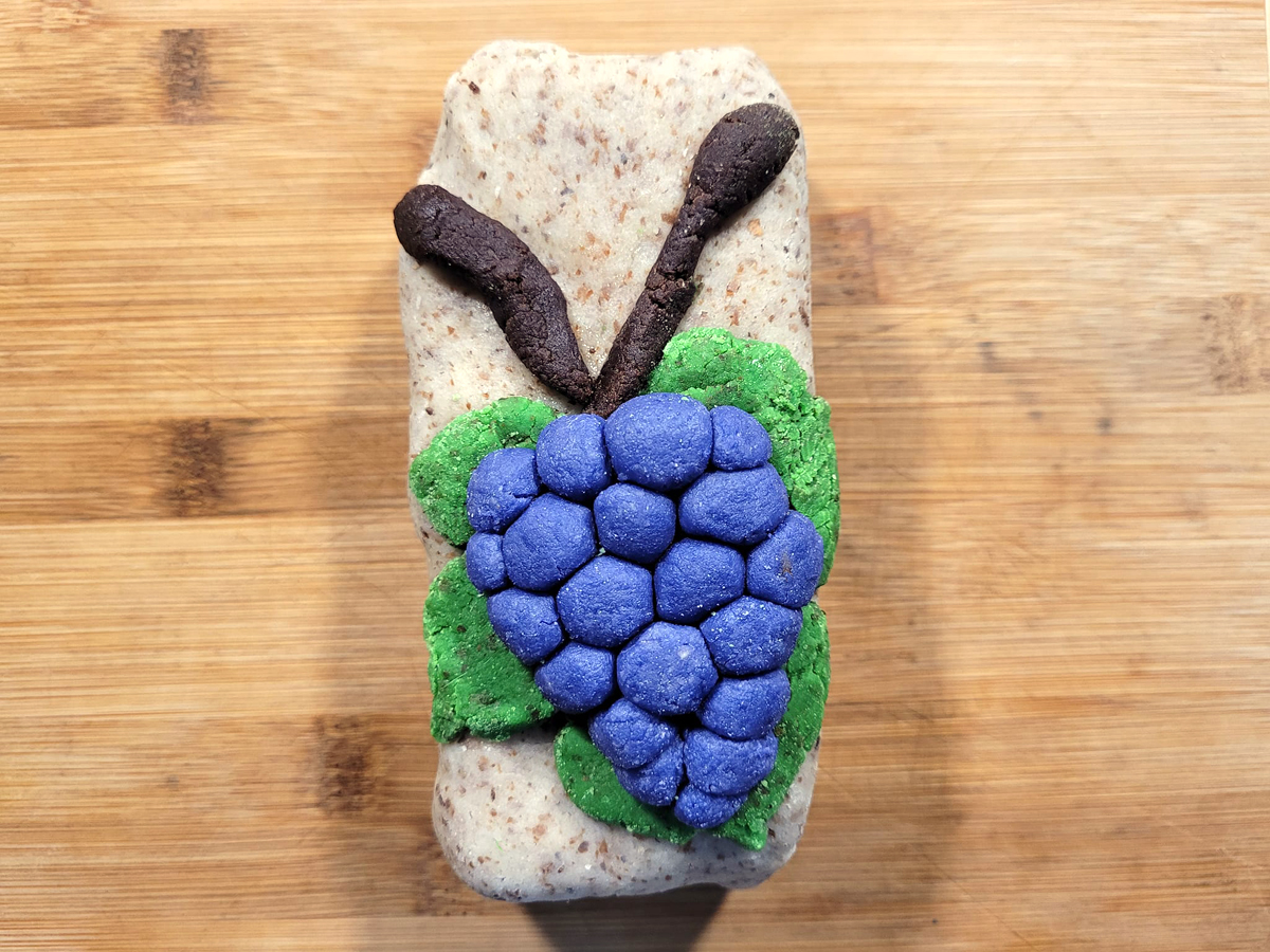 Marzipan Pinot Noir on unbleached almond marzipan, on English fruitcake made with home-candied fruits.