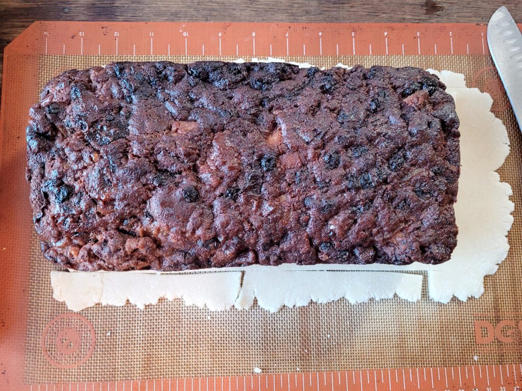 Trimming marzipan excess to fit fruitcake