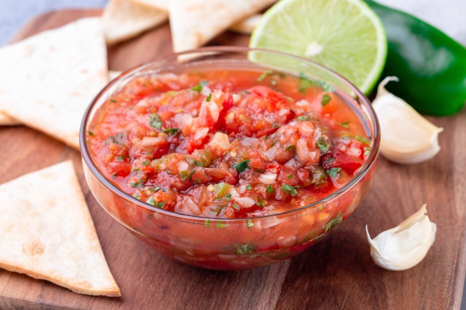Salsa Asada with roasted vegetables, served with a tortilla chips and lime, horizontalSalsa Asada