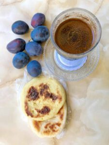 Greek coffee with plums and pancakes