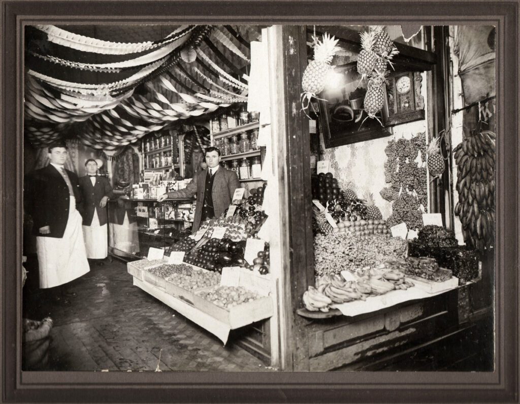 Papou, Chris Hurmuses store on Main Street in Vancouver., standing with his brothers